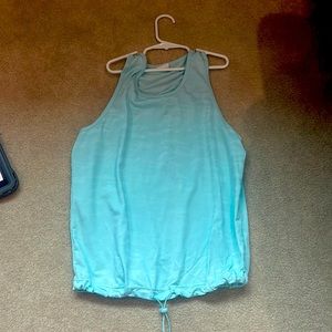 Light blue camouflage shirt, with an adjustable waist band.